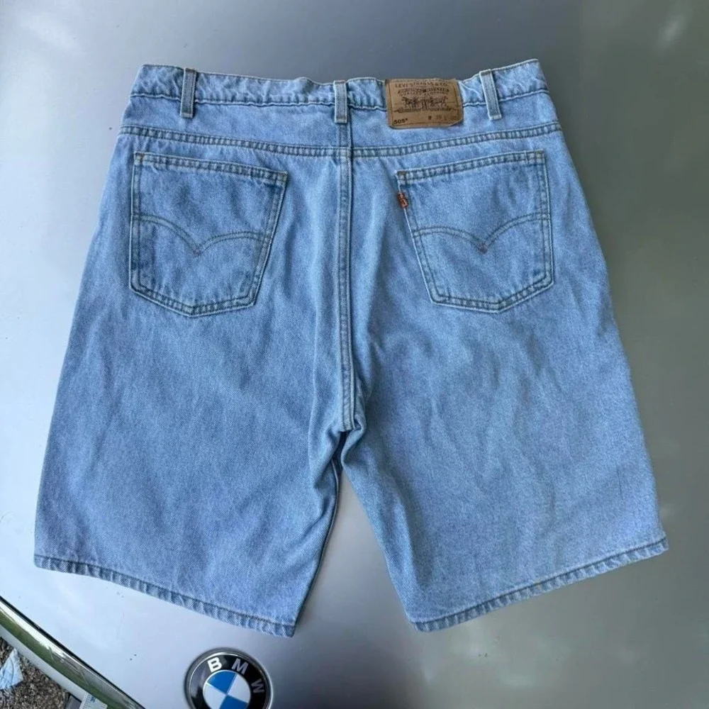 90s Vintage Orange tab Levi's 505 light blue denim shorts
